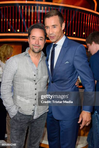 Jan Josef Liefers and Kai Pflaume during the 'Klein gegen Gross - Das unglaubliche Duell' TV Live Show at Studio Berlin Adlershof on June 2, 2017 in...