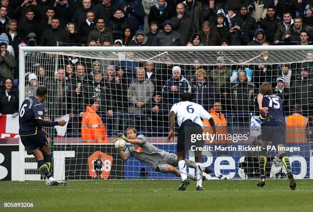Tottenham Hotspur's Tom Huddlestone penalty is saved by Bolton Wanderers' goalkeeper Jussi Jaaskelainen after referee Phil Dowd penalises Bolton...