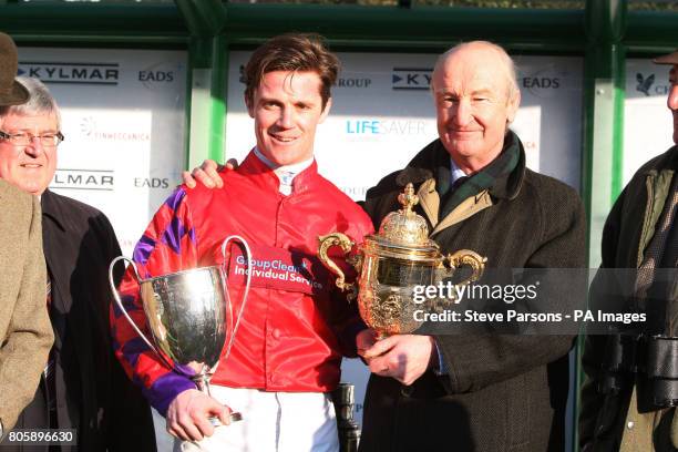 Capt Harry Wallace celebrates winning The Royal Atillery Gold Cup Steeple Chase Race with his father Major Malcolm Wallace who has also won the Royal...