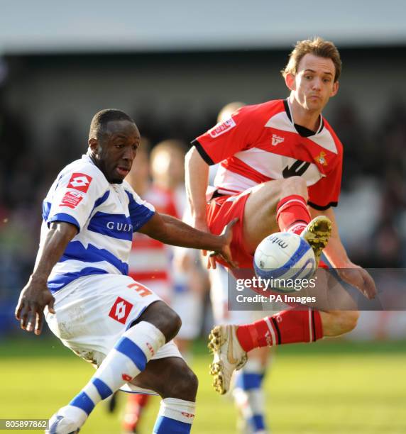 Queens Park Rangers' Damion Stewart and Doncaster Rovers' James Hayter during the Coca-Cola Championship match at Loftus Road, London.