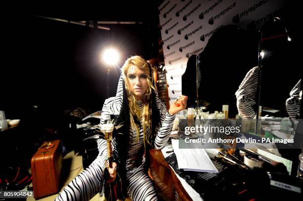 American singer Ke$ha poses backstage before performing a Myspace secret show at the Bathhouse, east London.