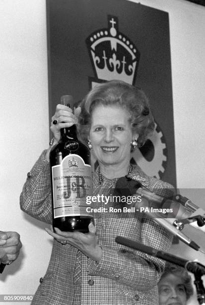 Prime Minister Margaret Thatcher holding the billionth bottle of Scotch Whisky to roll off the lines at the J&B distillery at Knockando, in...