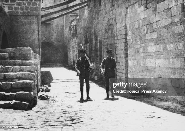 British soldiers patrol the streets of Jerusalem at the time of a visit by Lord Balfour, 2nd April 1925. The city's Arab residents were on strike as...