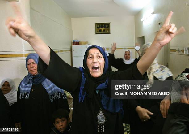 Palestinian woman grieves during the funeral of Atef and Ahmed al-Garabli in Gaza City on April 10, 2008. Israel warned today it will retaliate...