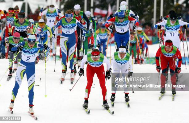 Eventual winner Poland's Justyna Kowalczyk along with fellow competitors take part in the Cross Country Skiing Womens 30km Mass Start Classic at the...