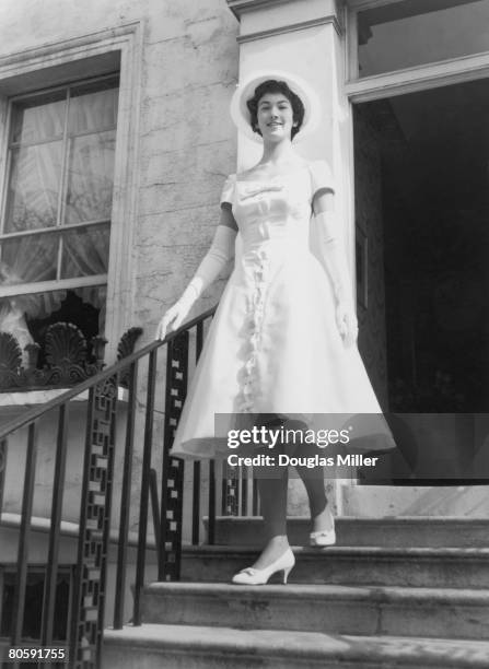 Elfrida Eden, niece of Sir Anthony Eden, leaves Victoria Road in Kensington for a presentation party at Buckingham Palace, 20th March 1958.