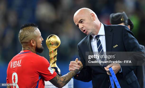 Arturo Vidal of Chile is greeted by FIFA President Gianni Infantino after the FIFA Confederations Cup Russia 2017 Final match between Chile and...