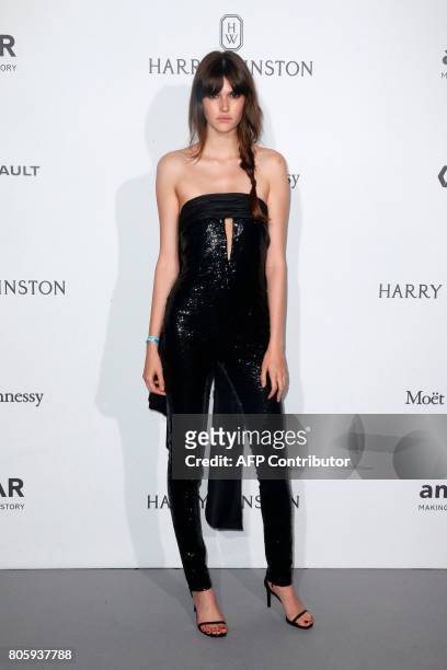 Model Vanessa Moody poses during a photocall, as part of a dinner organized by the foundation for AIDS research amfAR on July 2, 2017 at the Grand...