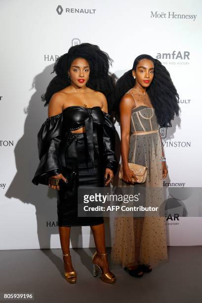 Cipriana and TK Quann pose during a photocall, as part of a dinner organized by the foundation for AIDS research amfAR on July 2, 2017 at the Grand...
