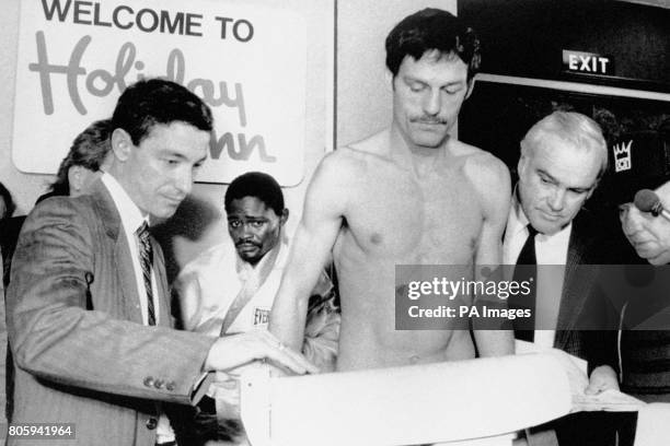 Pat Cowdell weighs in at the Holiday Inn in Birmingham, watched by Azumah Nelson, who defends his WBC Featherweight title when he meets Cowdell at...
