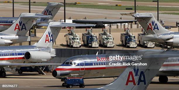 Grounded American Airlines MD-80 aircraft sit on the tarmac April 10, 2008 at the Dallas Fort Worth International Airport in Irving, Texas. American...
