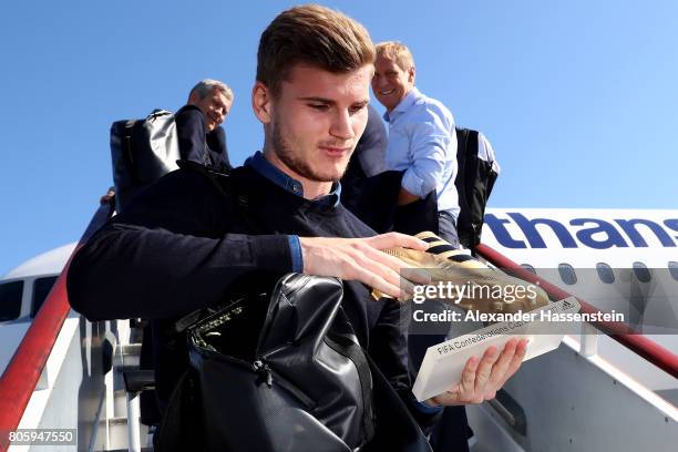 Timo Werner presents the golden shoe trophy prior to the departure of Germany at Sankt Petersburg Pulkovo Airport Airport on July 3, 2017 in Saint...