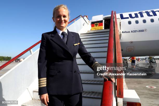 Captain Susanne Hertneck poses in front of the plane prior to the departure of Germany at Sankt Petersburg Pulkovo Airport Airport on July 3, 2017 in...