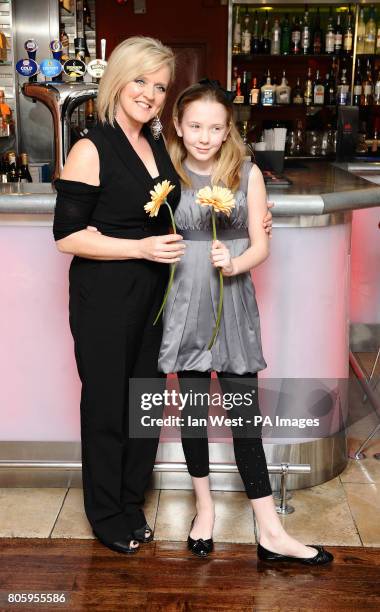 Bernie Nolan and her daughter Erin arrive at the Planet Hollywood Mothers' Day Brunch in London.