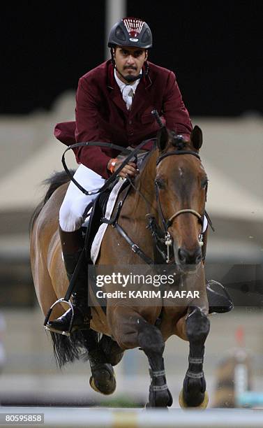 Qatar's rider Sheikh Ali bin Khalid al-Thani rides his horse during the Qatar International horse show, Global Champions Tour, in Doha on April 10,...