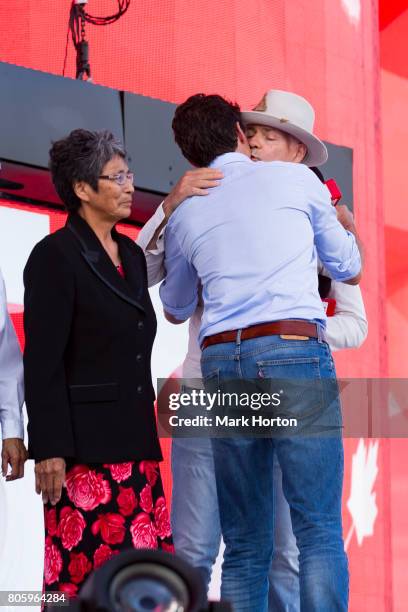 Pearl Wenjack looks on as Prime Minister of Canada Justin Trudeau greets Gord Downie at We Day Canada at Parliament Hill on July 2, 2017 in Ottawa,...