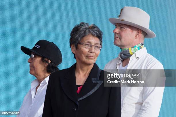 Daisy Wenjack, Pearl Wenjack and Gord Downie watch a performance at We Day Canada at Parliament Hill on July 2, 2017 in Ottawa, Canada.