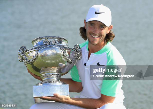 Tommy Fleetwood of England poses with the trophy after winning the HNA Open de France at Le Golf National on July 2, 2017 in Paris, France.