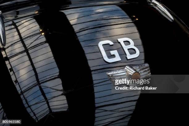 Detail of a GB car badge on the back of a British Morris Minor vintage car, on 29th June 2017, in Greenwich, London, England.