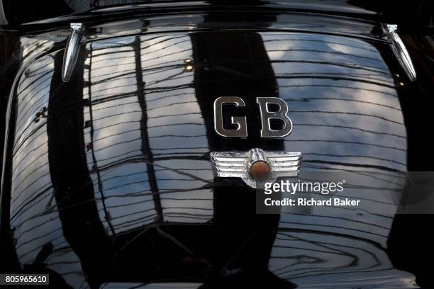 Detail of a GB car badge on the back of a British Morris Minor vintage car, on 29th June 2017, in Greenwich, London, England.