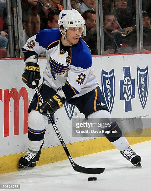 Paul Kariya of the St. Louis Blues sets up behind the net during a NHL game against the Detroit Red Wings on March 28, 2008 at Joe Louis Arena in...