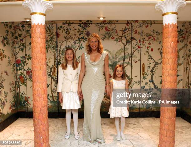 Tania Bryer in a Bruce Oldfield dress with daughters Natasha and Francesca, backstage at The Dorchester Hotel for The Goldilocks Fashion Show in aid...