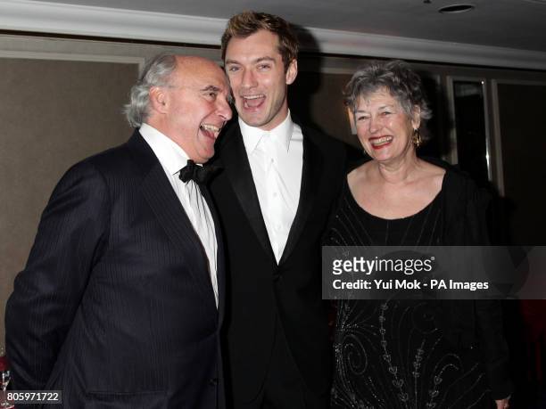 Jude Law and his parents Peter and Margaret arrive for the Laurence Olivier Awards at the Grosvenor House Hotel in central London.