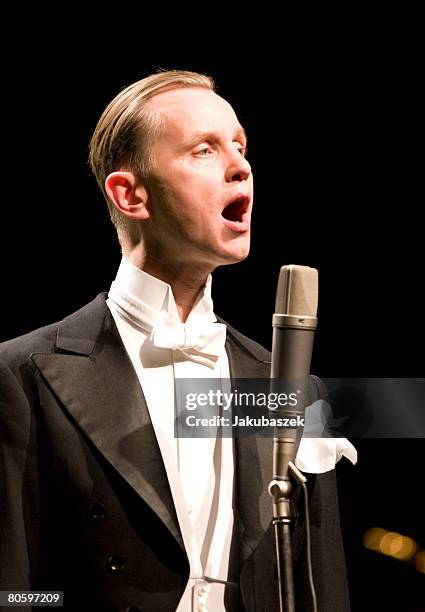 German singer Max Raabe performs live with the Palast Orchester during a concert at the Admiralspalast on April 10, 2008 in Berlin, Germany. The...