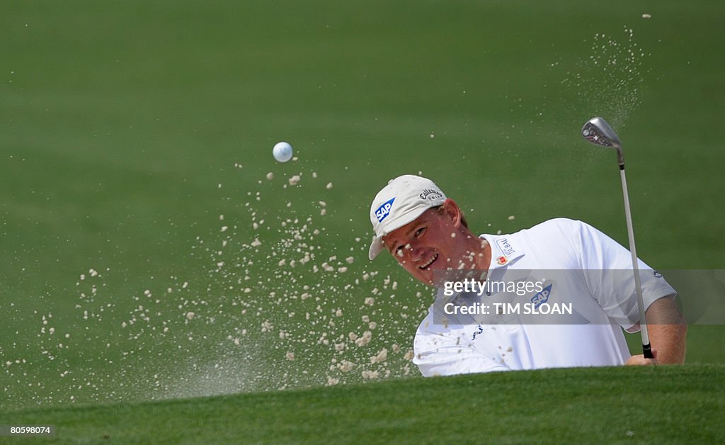 South African golfer Ernie Els blasts out of the sand on the second South African golfer Ernie Els blasts out of the sand on the second