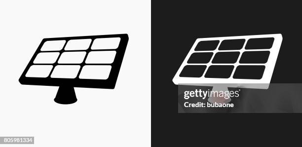 solar panel icon on black and white vector backgrounds - solar panel worker stock illustrations