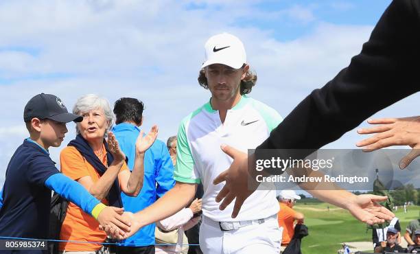 Tommy Fleetwood of England interacts with fans on the 15th hole during the final round of the HNA Open de France at Le Golf National on July 2, 2017...