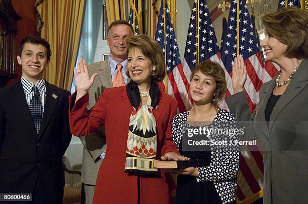 April 10: California Democrat Jackie Speier, during a mock swearing in with Speaker Nancy Pelosi, far right. With her are son Jackson Dennis, husband...