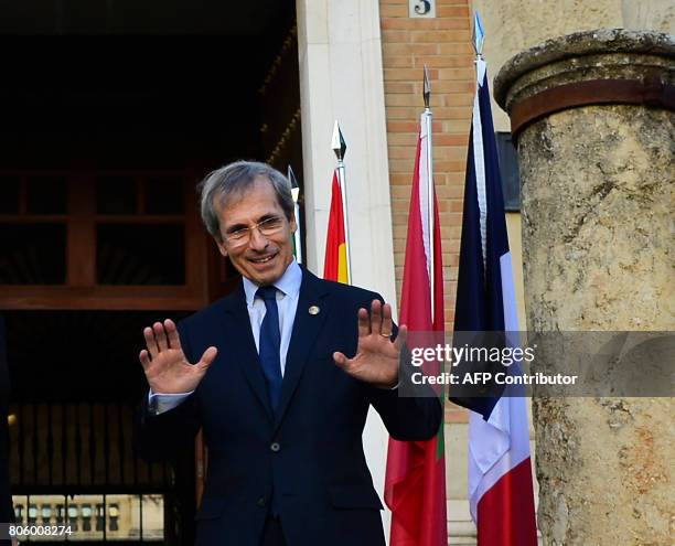 French Ambassador to Spain Yves Saint-Geours gestures as he poses before a meeting at the "Archivo General de Indias" in Seville on July 3 during the...