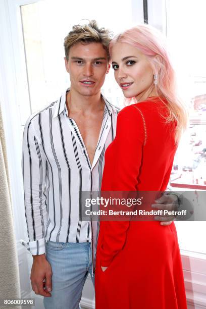 Pixie Lott and her companion Model Oliver Cheshire attend the Schiaparelli Haute Couture Fall/Winter 2017-2018 show as part of Haute Couture Paris...