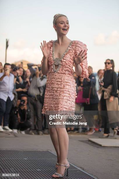 Elle Fanning outside the Miu Miu Cruise 2018 show on July 2, 2017 in Paris, France.