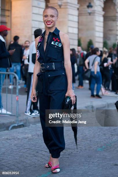 Adwoa Aboah wears a Miu Miu sleeveless boiler suit outside the Miu Miu Cruise 2018 show on July 2, 2017 in Paris, France.