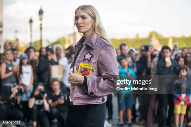 Elena Perminova wears Miu Miu outside the Miu Miu Cruise 2018 show on July 2, 2017 in Paris, France.