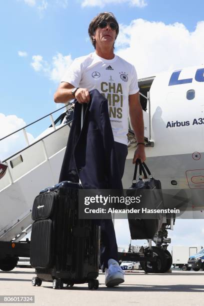 Joachim Loew, head coach of the German national team arrives with his team at Frankfurt am Main International Airpoport on July 3, 2017 in Frankfurt...