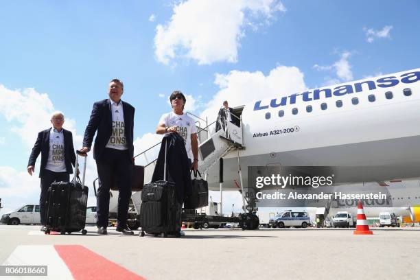 Joachim Loew , head coach of the German national team arrives with Reinhard Grindel , president of the German Football Association and Reinhard...