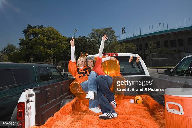 gesturing women on tailgate - bubble chair stock pictures, royalty-free photos & images