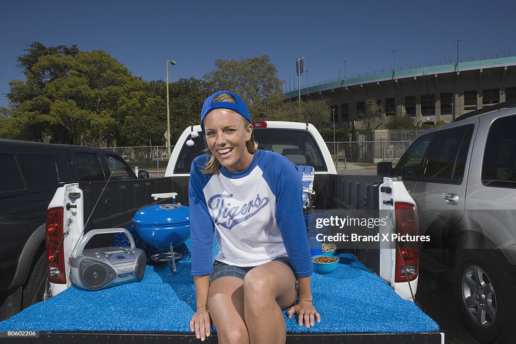 Woman smiling on tailgate