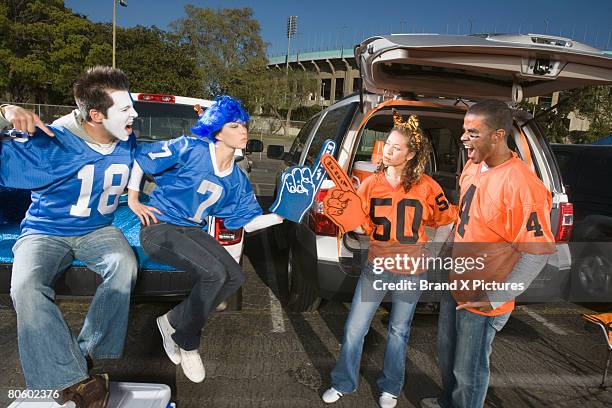 rival fans arguing - man face paint stock pictures, royalty-free photos & images