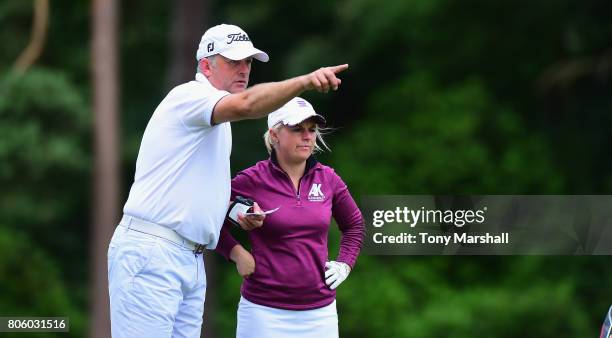 Alexandra Keighley of Huddersfield Golf Club and her caddy line up her shot on the 13th tee during the Titleist and FootJoy Women's PGA Professional...