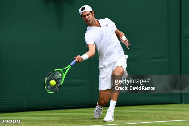 Karen Khachanov of Russia plays a forehand during the Gentlemen's Singles first round match against Andrey Kuznetsov of Russia on day one of the...