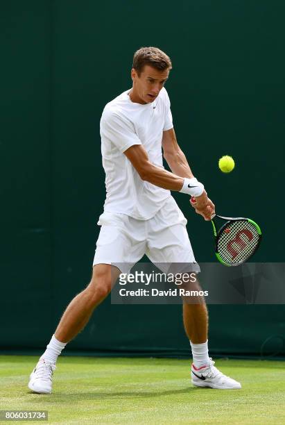 Andrey Kuznetsov of Russia plays a backhand during the Gentlemen's Singles first round match against Karen Khachanov of Russiaon day one of the...