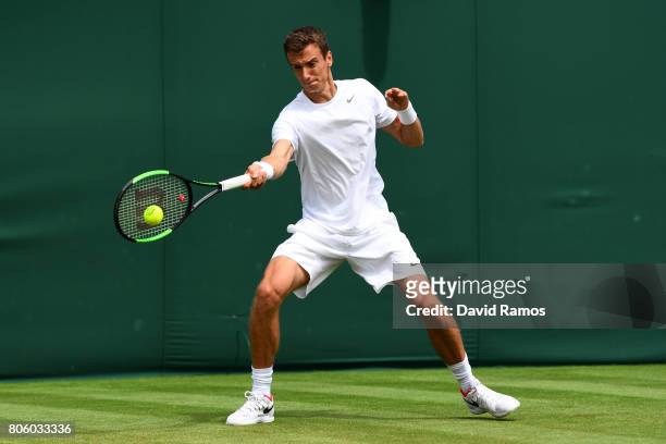 Andrey Kuznetsov of Russia plays a forehand during the Gentlemen's Singles first round match against Karen Khachanov of Russiaon day one of the...