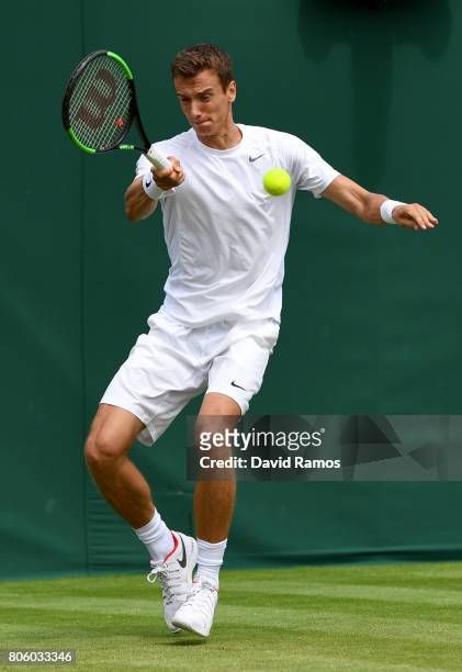 Andrey Kuznetsov of Russia plays a forehand during the Gentlemen's Singles first round match against Karen Khachanov of Russiaon day one of the...