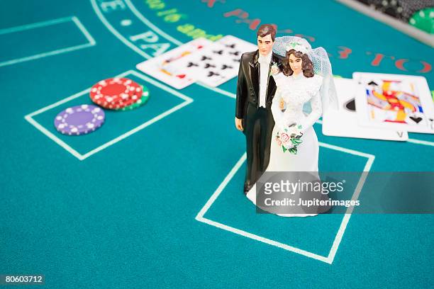 bride and groom figurine on betting table - las vegas wedding ストックフォトと画像