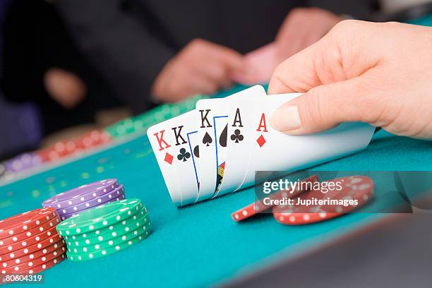 card player with full house - volles haus stock-fotos und bilder