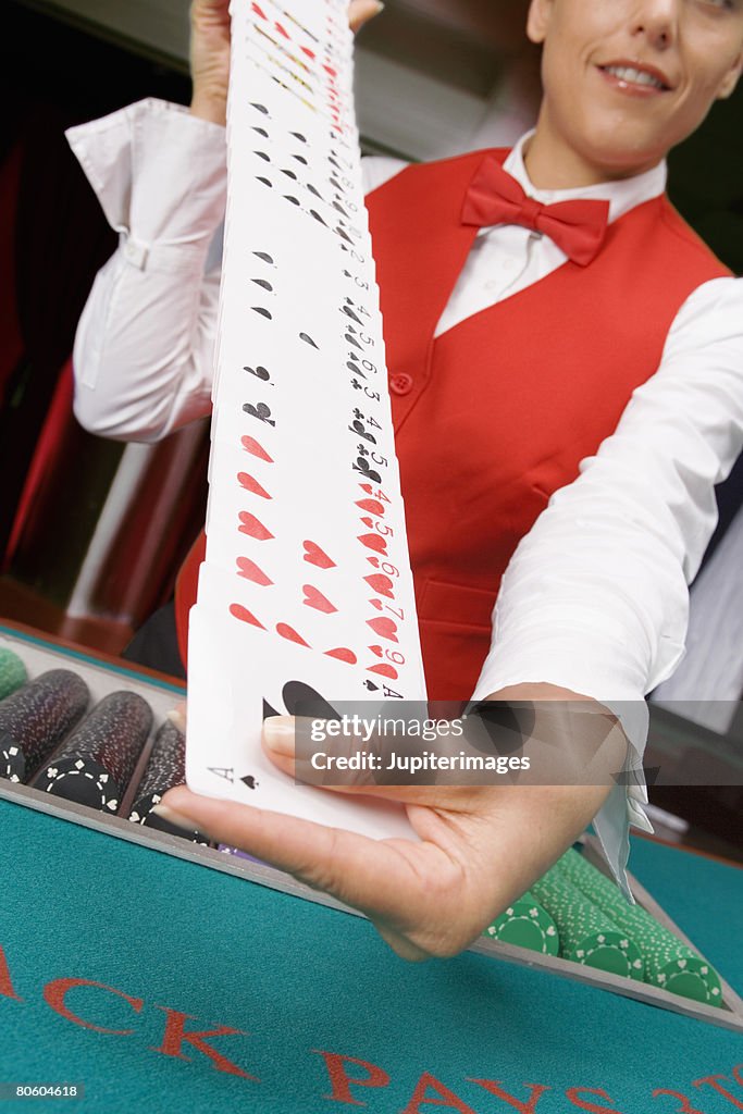 Dealer shuffling cards
